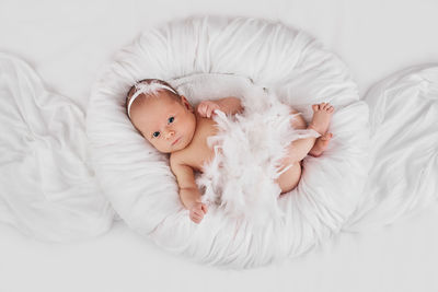 Close-up of baby sleeping on bed