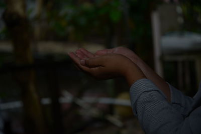 Close-up of hand on land