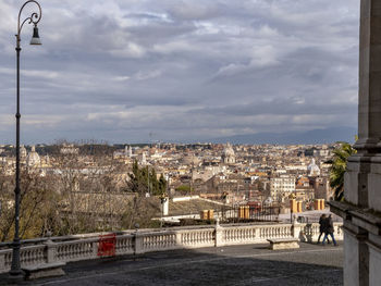 View of city against cloudy sky