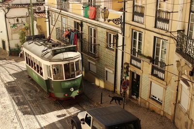 View of buildings in city anda tram