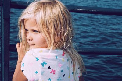 Portrait of cute girl in water