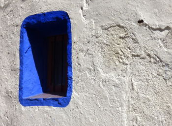 Blue window on wall