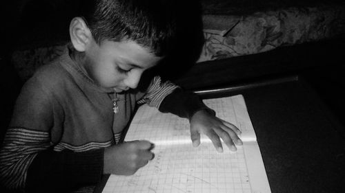 High angle view of boy looking at home