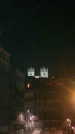 Buildings in city at night