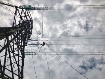 Low angle view of electricity pylon against sky