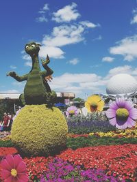 Statue of flowers against sky