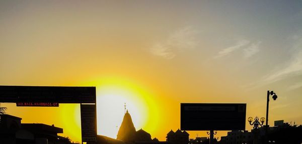 Low angle view of silhouette buildings against sky during sunset