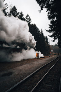 Train on railroad track against sky