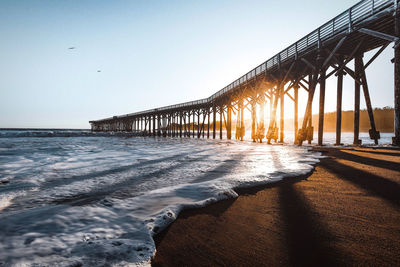 A pier during golden hour by the coast of california