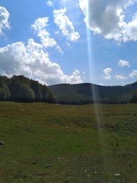 Scenic view of field against sky