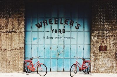 Bicycles parked against wall