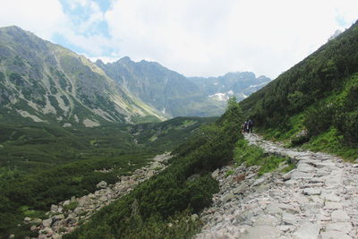 Scenic view of mountains against cloudy sky