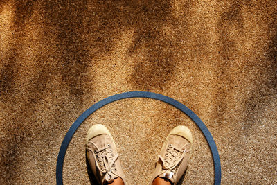 Low section of man standing on floor