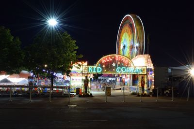 View of illuminated street at night