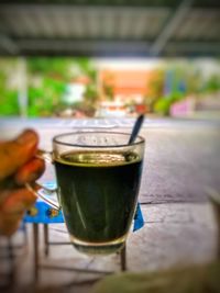 Close-up of beer glass on table