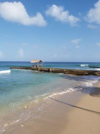 Scenic view of beach against sky