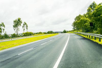 Road passing through forest