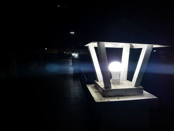 Close-up of illuminated light bulb in the dark