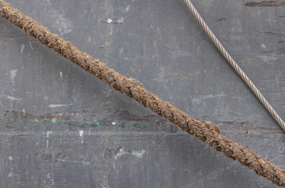 Close-up of rope against abstract background