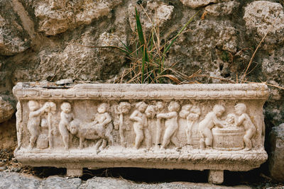 Statue of buddha against wall