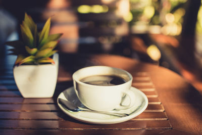Close-up of coffee cup on table