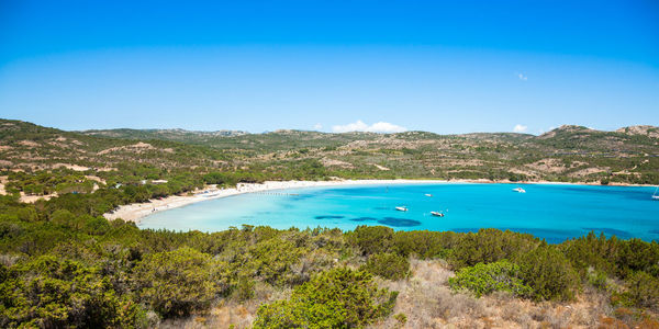 Scenic view of sea against blue sky