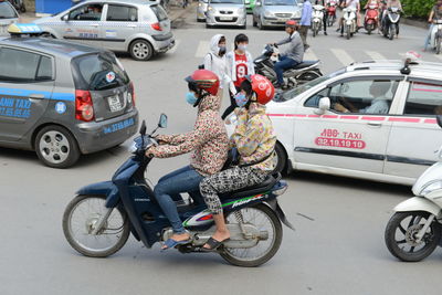 Bicycles parked on road in city