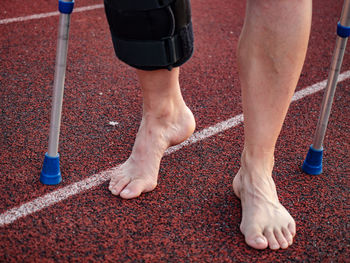 Low section of man running on floor