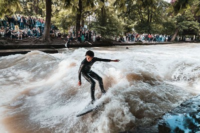 Full length of man surfing in water