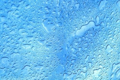 Close-up of water drops on glass