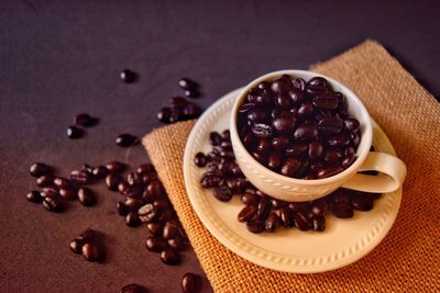 Close-up of coffee beans on table