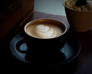 High angle view of coffee cup on table