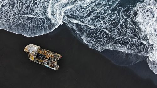 High angle view of wrecked ship  at the beach