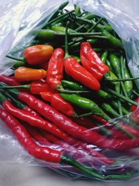 Close-up of red chili peppers in container