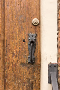 High angle view of ancient iron door handle in wooden frontdoor, utrecht, the netherlands