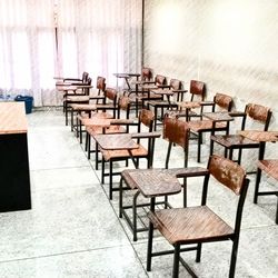 High angle view of empty chairs and table