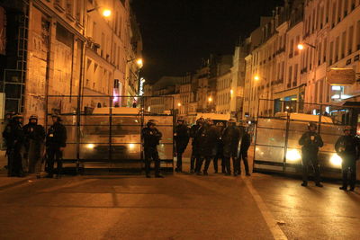 People on city street at night