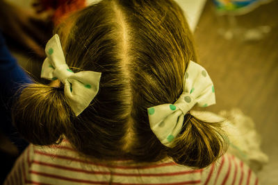 Rear view of girl with pigtails