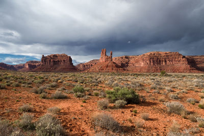 View of rock formations against cloudy sky