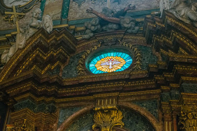 Low angle view of ornate ceiling of building