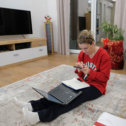 Man sitting on table at home