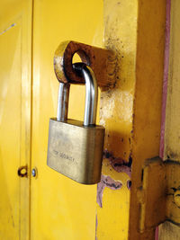 Close-up of padlock on door