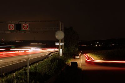 Traffic light trails on road at night