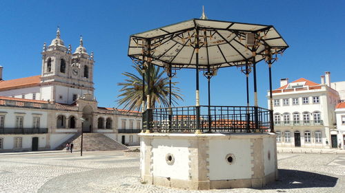 Low angle view of building against clear blue sky