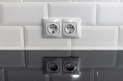 Close-up of electrical outlet on wall