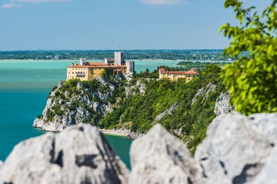 Gulf of trieste. high cliffs between boats, karst rocks and ancient castles. duino. italy