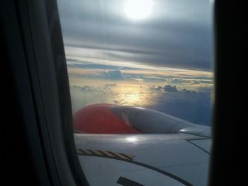 Airplane seen through glass window