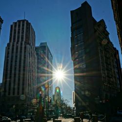 View of city street at sunset