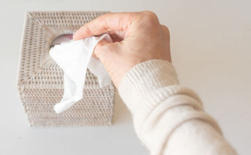 Close-up of man holding paper