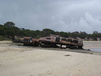 Train on beach against sky